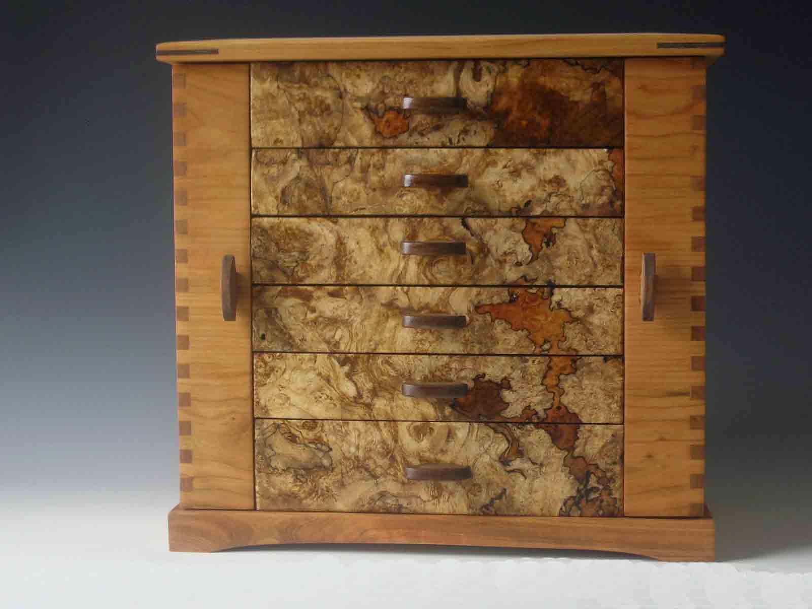 Handmade standing jewelry box made of cherry wood and burl; with two side doors and six drawers