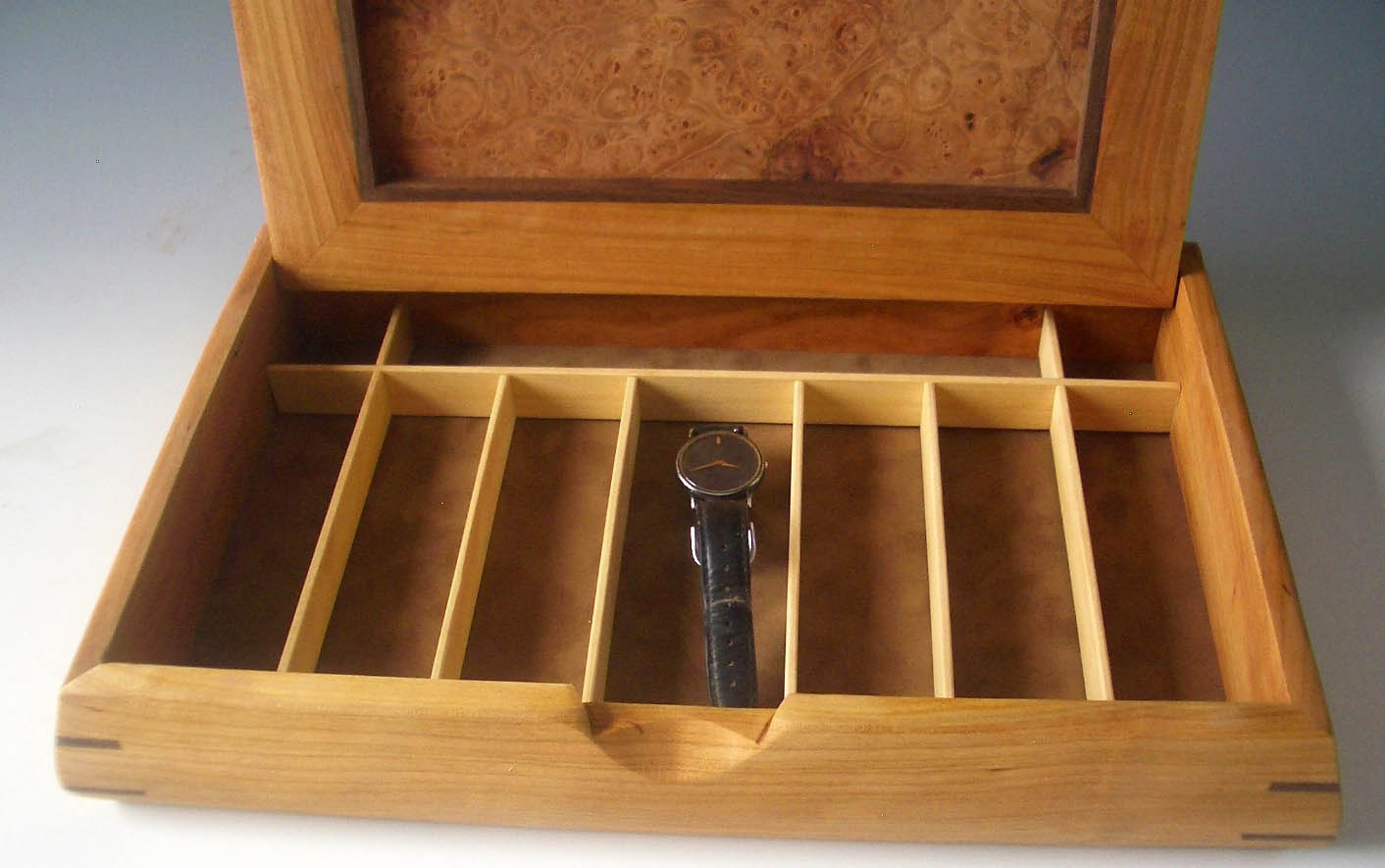 Man jewelry watch box handmade of beautiful woods; photo shows box open with long compartments to hold watches